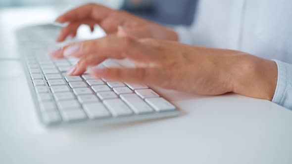 Female Hands Typing on a Computer Keyboard. Concept of Remote Work.