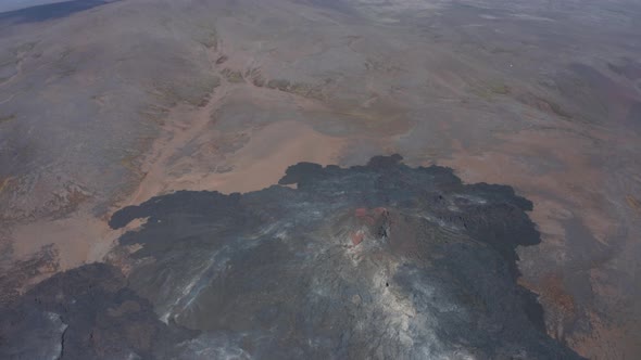 Spectacular High Aerial Drone View of Fagradalsfjall Volcano Black Lava Surrounding Volcanic Cone