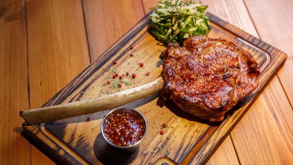 Big juicy beef steak on bone cooked on grill for dinner