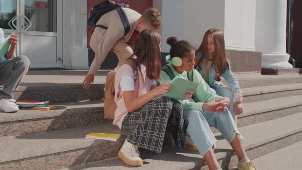 Schoolkids Using Tablet Outside