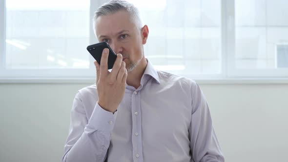 Middle Aged Man Talking on Phone