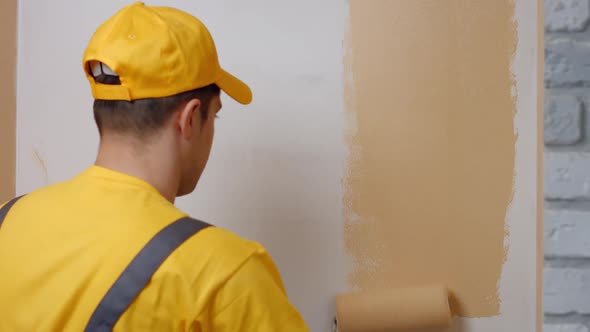 Builder Paints White Wall