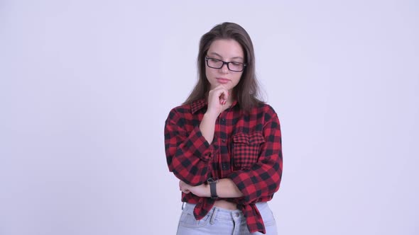 Serious Young Hipster Woman Thinking and Looking Down