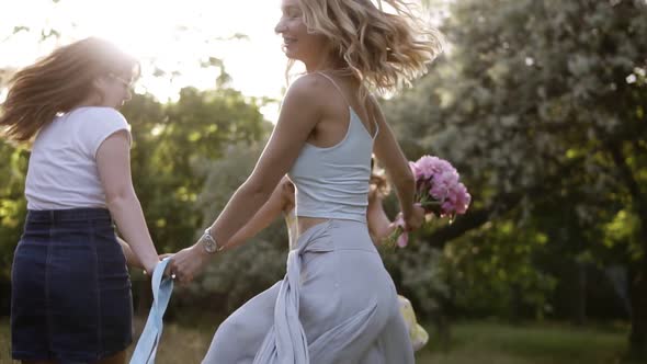 Cheerful Girlfriends Having Fun Together Outdoors