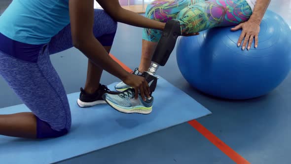 Woman exercising with a prosthetic leg