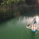 Experienced SUP Surfer Rows with Paddle on Board - VideoHive Item for Sale