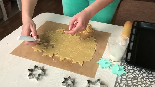 A Woman Makes Biscuits From Biscuit Dough.