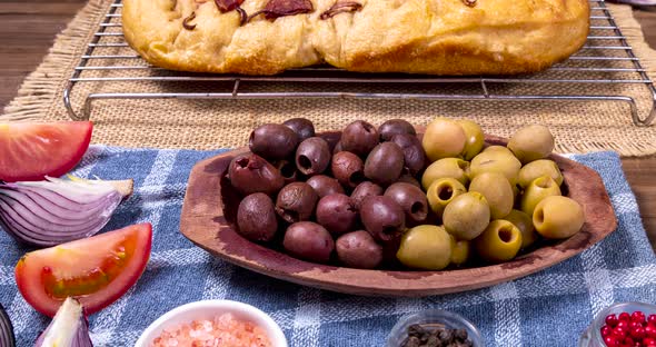 Traditional Italian Focaccia with pepperoni, cherry tomatoes, black olives, rosemary ando onion - ho