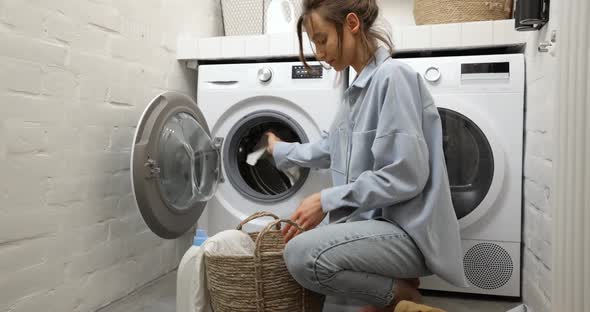Woman Washing Clothes at Home