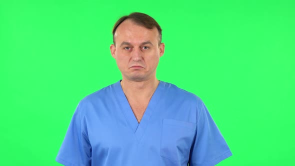 Medical Man Nods His Head Approvingly. Green Screen