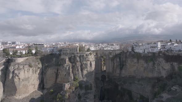 Aerial: Ronda Spain, famous for old stone bridge crossing deep canyon