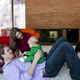 Parents playing with baby son in living room - VideoHive Item for Sale