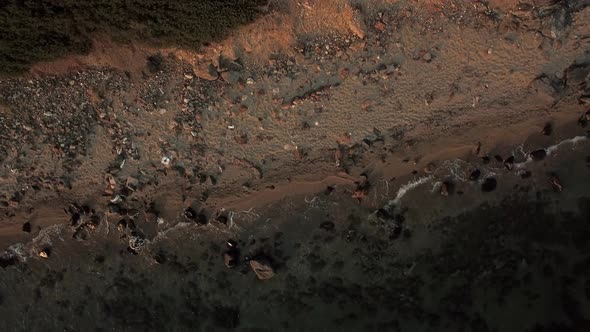 Aerial View of Sea Shore with Rocks and Stones