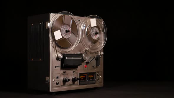 Taperecorder playing music isolated on black background and space for copy