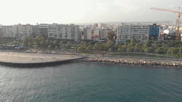 Limassol's Sea boulevard with palmtrees, Cyprus - Aerial View 4K drone shot