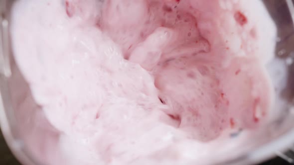 Blender Mixes Fresh Milk and Slices of Ripe Strawberry