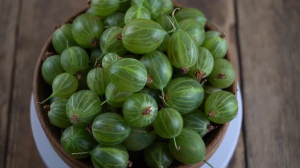 Green Gooseberries in a Wooden Bowl