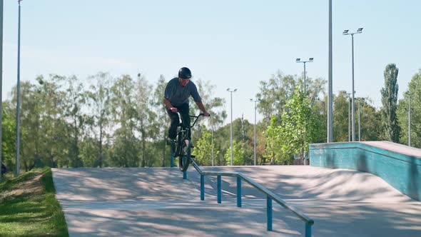 Bmx Sliding On The Railing In Park