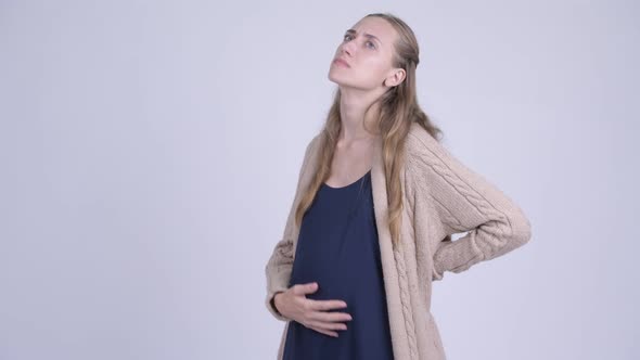 Young Stressed Pregnant Woman Having Back Pain