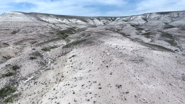 White Limestone Mesa Hill Topography on Plain in Arid Barren Geography