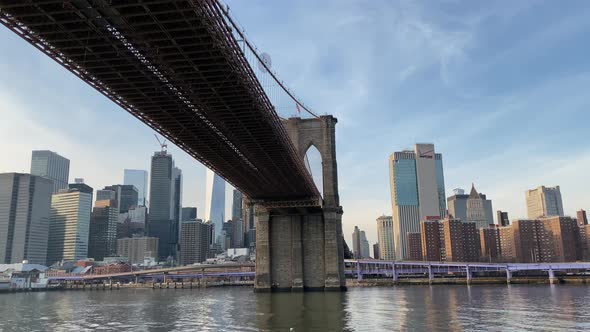 Sailing Under the Brooklyn Bridge with the View Over the Lower Manhattan