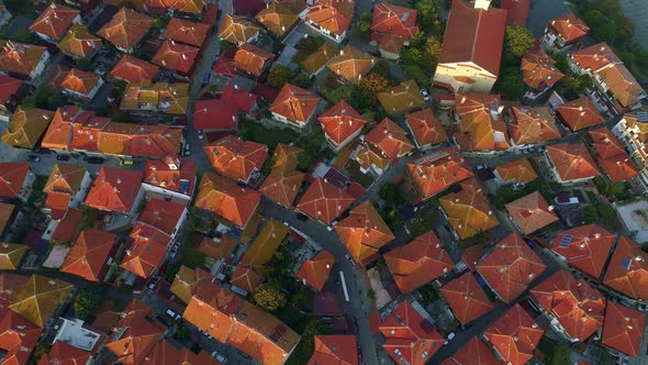 Rooftops of the Old European City. Aerial Top Down View. Narrow Winding Streets and Tiled Roofs of