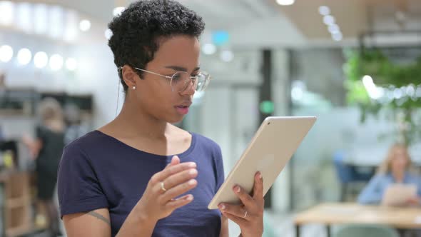 Portrait of Casual African Woman Having Loss on Tablet