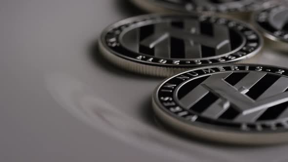 Rotating shot of Litecoin Bitcoins (digital cryptocurrency) - BITCOIN LITECOIN 0104