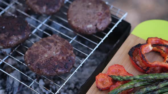 Beef Burgers Cutlets are Roasting on the Charcoal Barbecue Grill