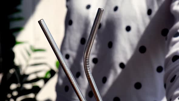 Slow Motion Woman Holding Reusable Metal Straw