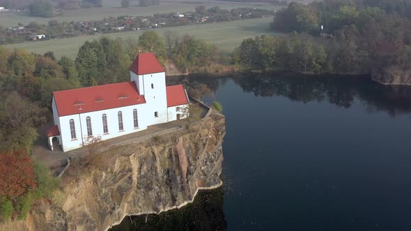 Church Overlooking a Small Lake on a Foggy Morning in Germany