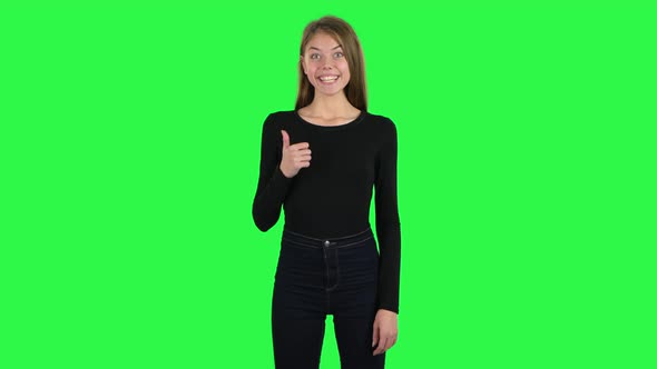 Young Cheerful Woman Showing Thumbs Up, Gesture Like. Green Screen