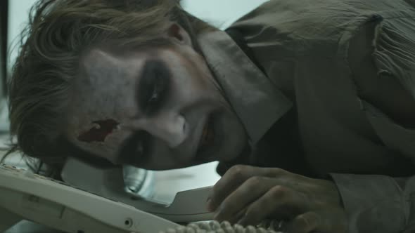 Zombie Office Worker Trying to Answer Phone
