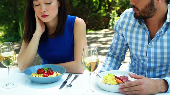 Couple interacting with each other in outdoor restaurant 4k