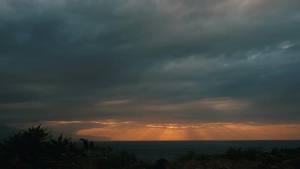 Beautiful Bright Sunset Over the Sea. Seascape with Sunset. Rays of the Sun Peeking Out From Behind