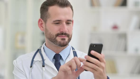 Portrait of Doctor Using Smartphone 