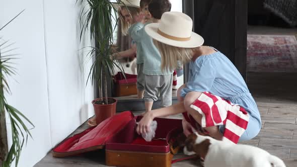 mother and son packing a suitcase for a trip home