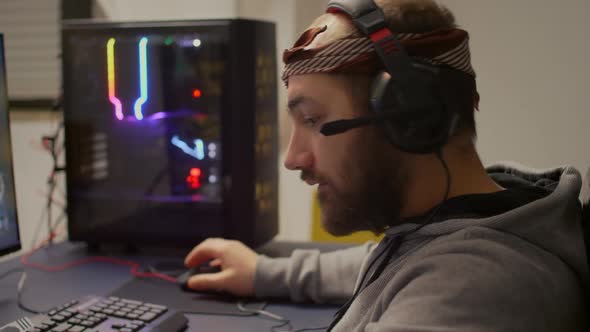 Pro Gamer Putting on Headset with Microphone