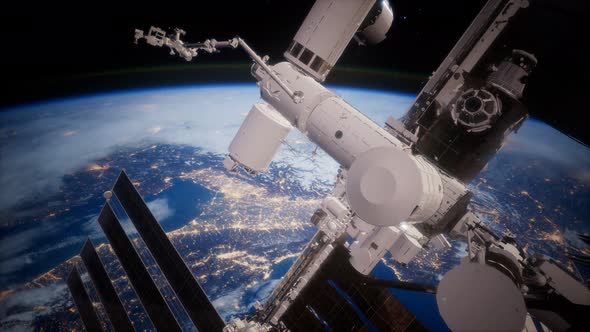 A View of the Earth and a Spaceship. ISS Is Orbiting the Earth