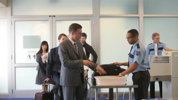 Group of business people at airport security checkpoint