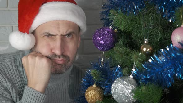 Unhappy Male in Christmas Decorations