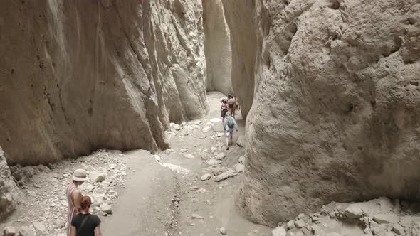 Drone Flying Through Narrow Canyon in Mountains