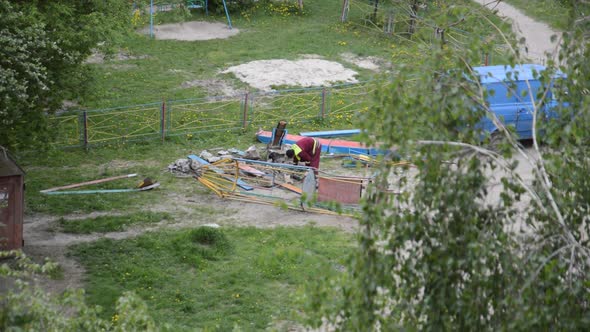 Worker dismantles in the playground