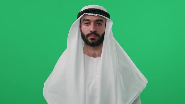 Slow Motion An Arab Man in Traditional Clothes on the Background of a Chroma Key Wearing Kandura