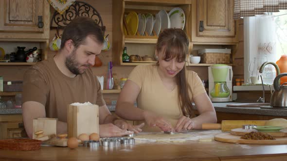 Husband and Wife Make Dough for Baking Together on a Day Off.