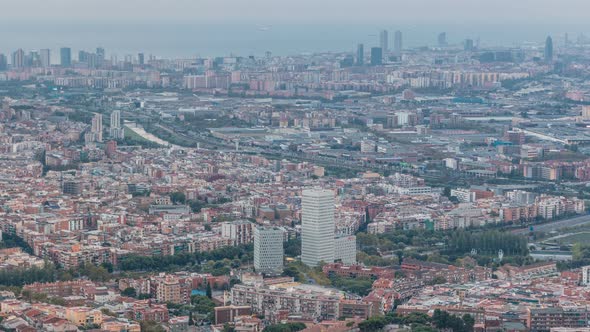 Barcelona and Badalona Skyline with Roofs of Houses and Sea on the Horizon at Evening Timelapse