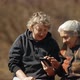 A Woman Teaches Her Old Mother To Use a Smartphone. Portrait of Two Women Looking at Smartphone - VideoHive Item for Sale
