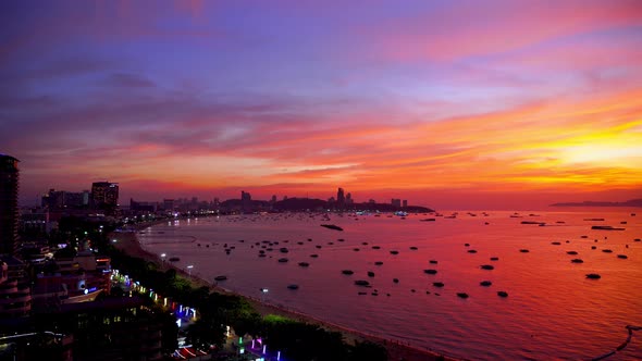 Aerial top view of of Pattaya beach in the evening and beautiful sunset sky 