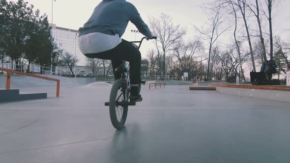 Bmx Rider Doing Tricks in Concrete Skatepark Slow Motion