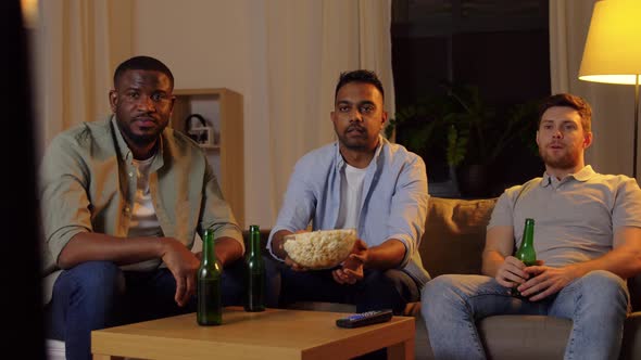 Happy Male Friends with Beer Watching Tv at Home